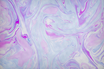 Fototapeta premium Abstract violet marble background. Stains of paint on the water.