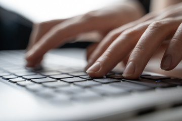 hands with laptop typing