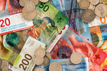 Swiss franc money in coins and colorful bills