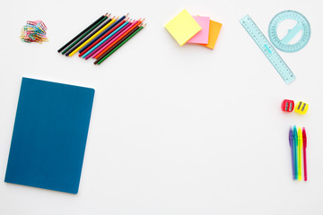 Flat Lay school desk with pencil colors, ruler, pens, postit