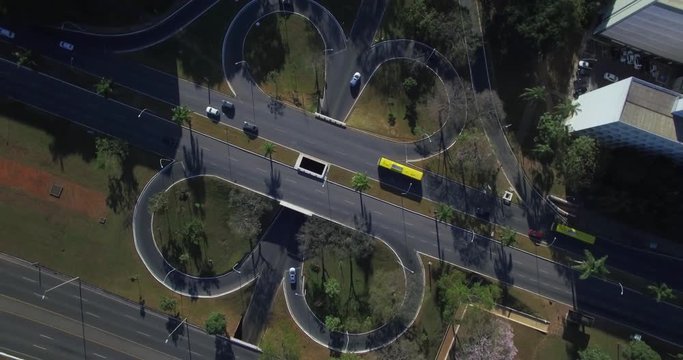Aerial rotating and descending top down over intersecting roads in Brasilia