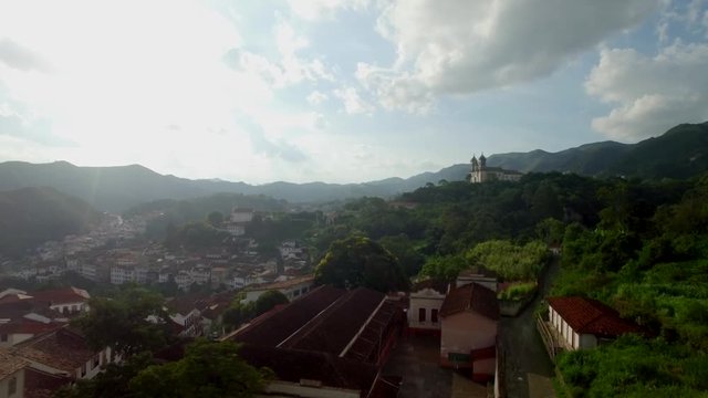 Wide aerial flying towards the Church of S&nbsp;o Francisco de Paula in Ouro Preto, Minas Gerais, Brazil