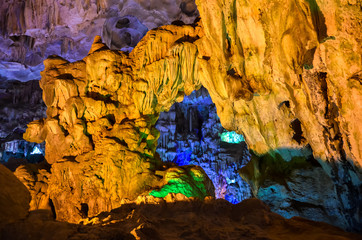 Blue and yellow lights in cave in Vietnam / Ha Long