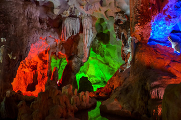 Green and red lights in cave in Vietnam