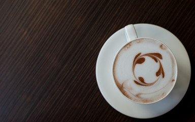 cup of coffee on wooden table