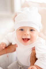 Mother, playing with her toddler boy smiling