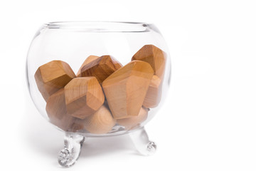 wooden cubes in a glass vase