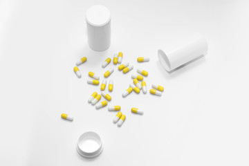 Yellow Pills on a white background, medical pills