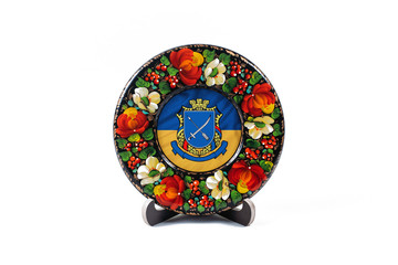 Petrikov painting on a wooden saucer