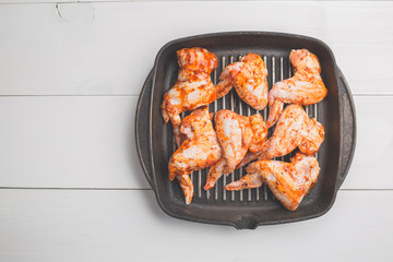 Raw chicken wings marinated