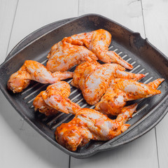 Raw chicken wings marinated