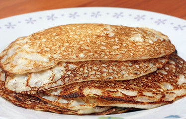 Pancakes on plate. Stack of thin pancakes.