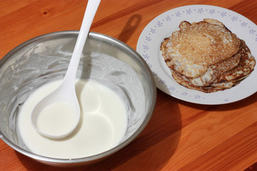 Pancake batter in bowl with ladle