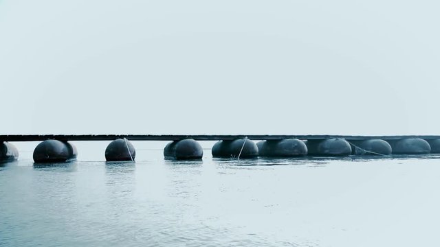 Videos of a temporary pontoon bridge made with used gas containers over river Ganga near Makhdoompur village in Hastinapur Wildlife Sanctuary at Meerut