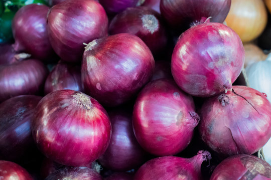 Bunch of red onions on a pile