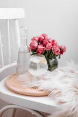 flowers in a vase on wooden table