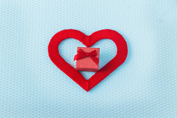 Red hearts and ring on a blue background. Valentine's Day. Valentines day greeting card. An offer of marriage. Engagement