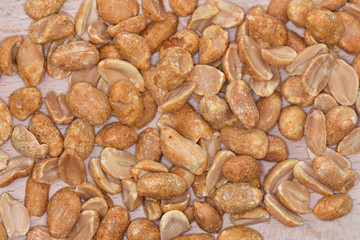 Spicy peanuts on a wooden platter