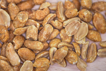 Spicy peanuts on a wooden platter