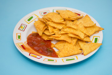 Tortilla with Salsa dip ,Potato chips and red sauce