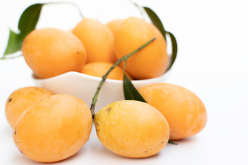 marian plum or plum mango , bouea macrophylla, on white background. Marian plum in Thai is called maprang.