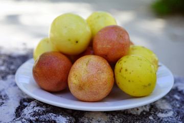 Platter of colorful ripe tropical passion fruit
