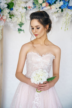 beautiful young woman in wedding dress, romantic image of the bride, beautiful make-up and hairstyle