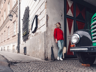 Attractive woman at the retro car
