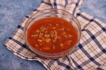 Pork goulash with pieces of meat in a bowl