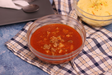 Pork goulash with pieces of meat in a bowl