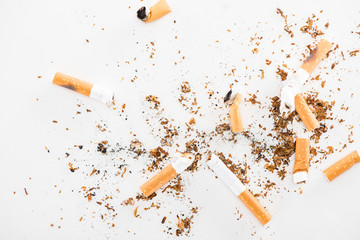 Top view of broken cigarettes isolated on white, stop smoking concept