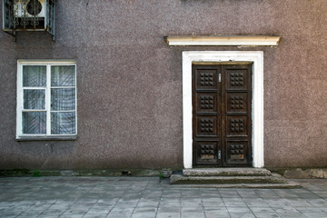 Fototapeta na wymiar old house, wall with grunge old door, texture