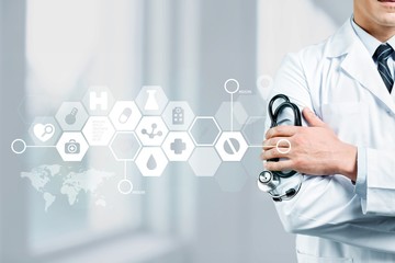 Young man doctor holding stethoscope