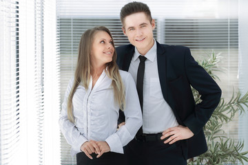 business couple standing in a modern office