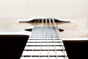Fototapeta premium Fragment of an acoustic guitar - closeup shot