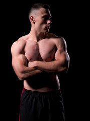 Fototapeta premium Young strong man isolated