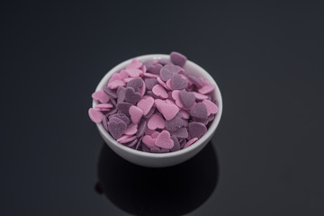 Purple ,Pink Candy Hearts,Colorful sweetss, sprinkle in a porcelain bowl