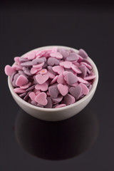 Purple ,Pink Candy Hearts,Colorful sweetss, sprinkle in a porcelain bowl