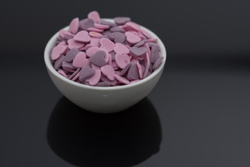 Purple ,Pink Candy Hearts,Colorful sweetss, sprinkle in a porcelain bowl