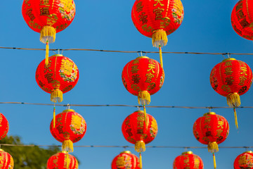 Fototapeta na wymiar Chinese new year lanterns on blue sky background in china town
