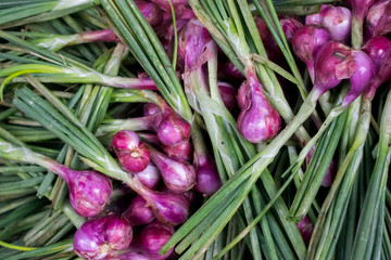 Fresh red onions with leaves