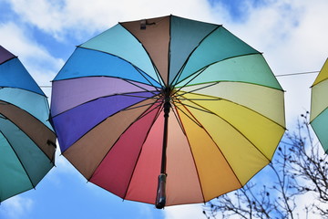 street decorated with colorful umbrellas