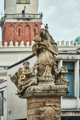 Fototapeta na wymiar Figure St. John of Nepomuk on the Old Market Square in Poznan.