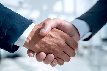 Close-up of business people handshaking
