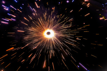 A firework or fire cracker called chakra looking like a rotating fireball, used during the traditional Diwali festival in India,christmas and new year.