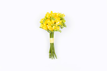 Bouquet of yellow flowers on white background. Flat lay, top view. Floral background. Valentines Day and Mother Day background
