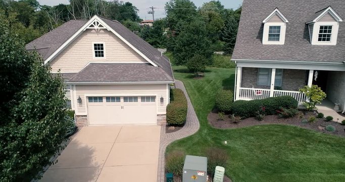 This Ultra High Definition drone aerial footage is of single family homes in a suburban community in Pennsylvania. The footage is a Dolly Shot of the homes.