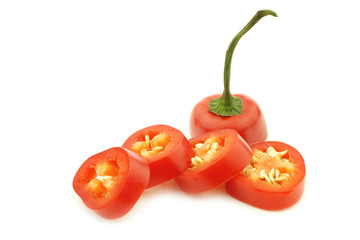 cut red jalapeno pepper (capsicum) on a white background
