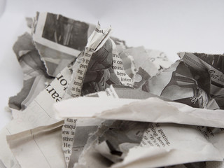 torn and crumpled newspaper