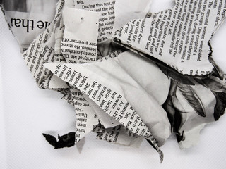 torn and crumpled newspaper
